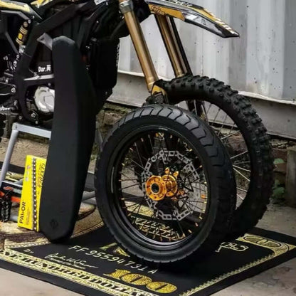 Customizable MXR Ultra Bee Supermoto Wheelset showcased with performance tires and stylish design on a patterned mat.